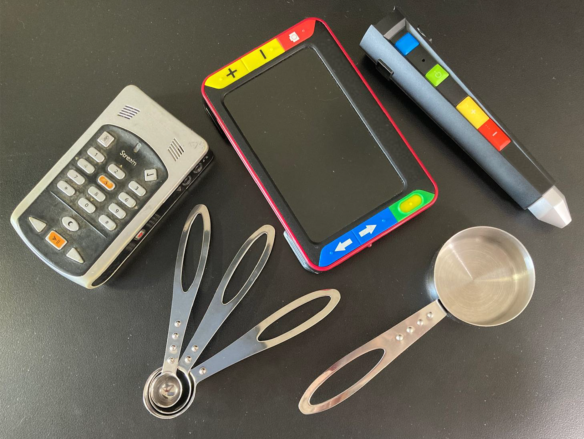 Infographic titled “Types of items we can accept” showing examples of acceptable donations, including audiobook readers, video magnifiers, braille measuring cups and spoons for cooking and a digital audio label reading wand.